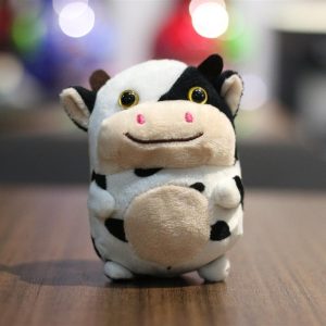Mignonne petite vache en peluche